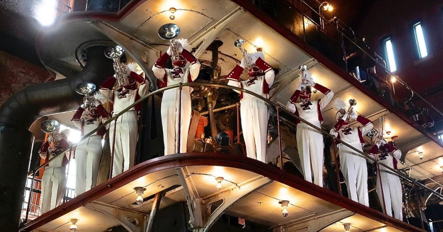 Marching Band musicians standing on a catwalk