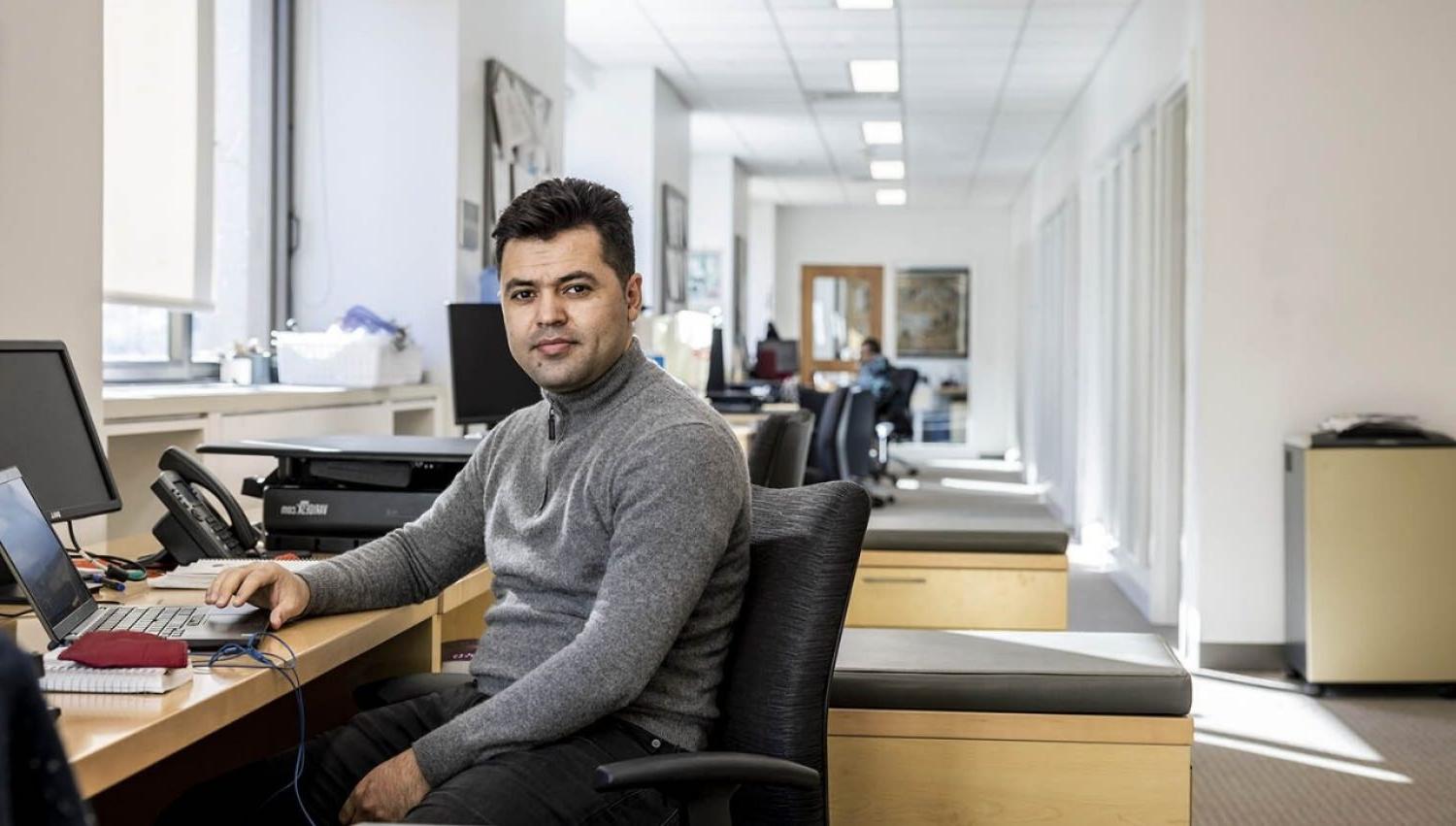 A man sitting at a desk