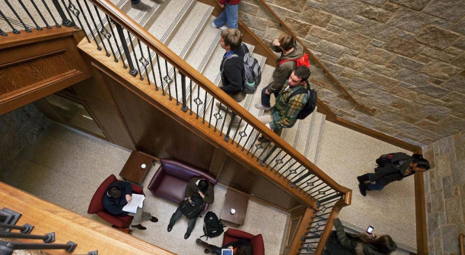 overhead view of a student taking notes in class