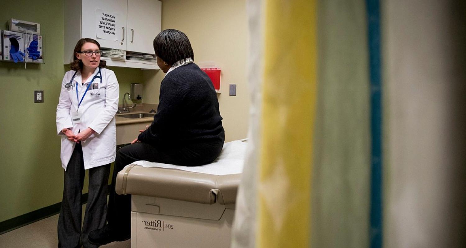 a nursing student with a patient in a clinical setting