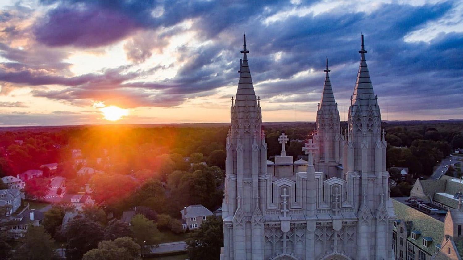 sun setting over top of gasson