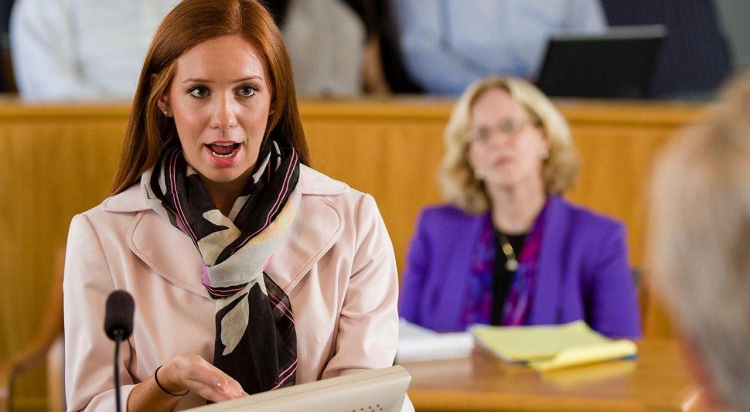 a person standing in a courtroom