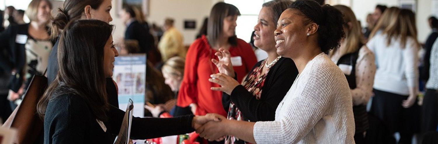 people speaking at a career fair