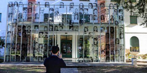 Assistant Professor of the Practice of Philosophy David Storey takes a photo of the entrance to a memorial museum located in buildings that once housed a detention and torture center on the site of Argentina's former naval academy.